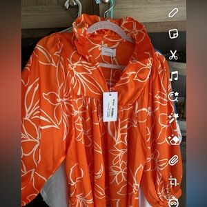 Orange Adrienne brand silky top with ruffle colar